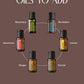 A promotional graphic on a muted brown background with the text 'POPULAR OILS TO ADD' above six small essential oil bottles arranged in a circle. The labeled bottles include Rosemary, RevitaZen, Lemon, Fennel, Ginger, and Geranium. doTERRA Castor Oil Wrap Pack