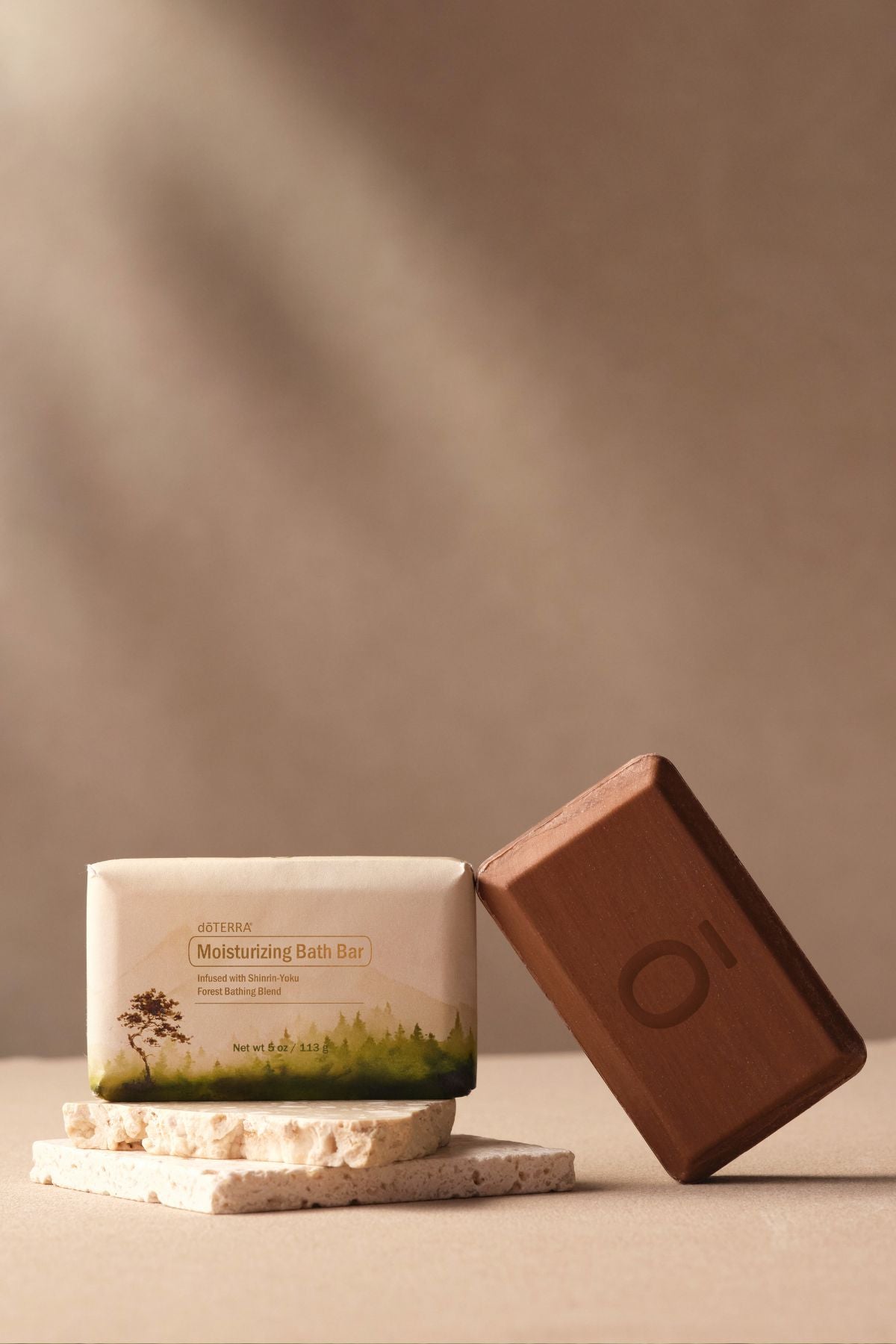 Bar of soap with packaging on a neutral background